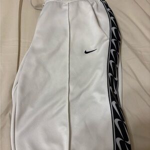 Nike White Track Pants with Black Swoosh Design